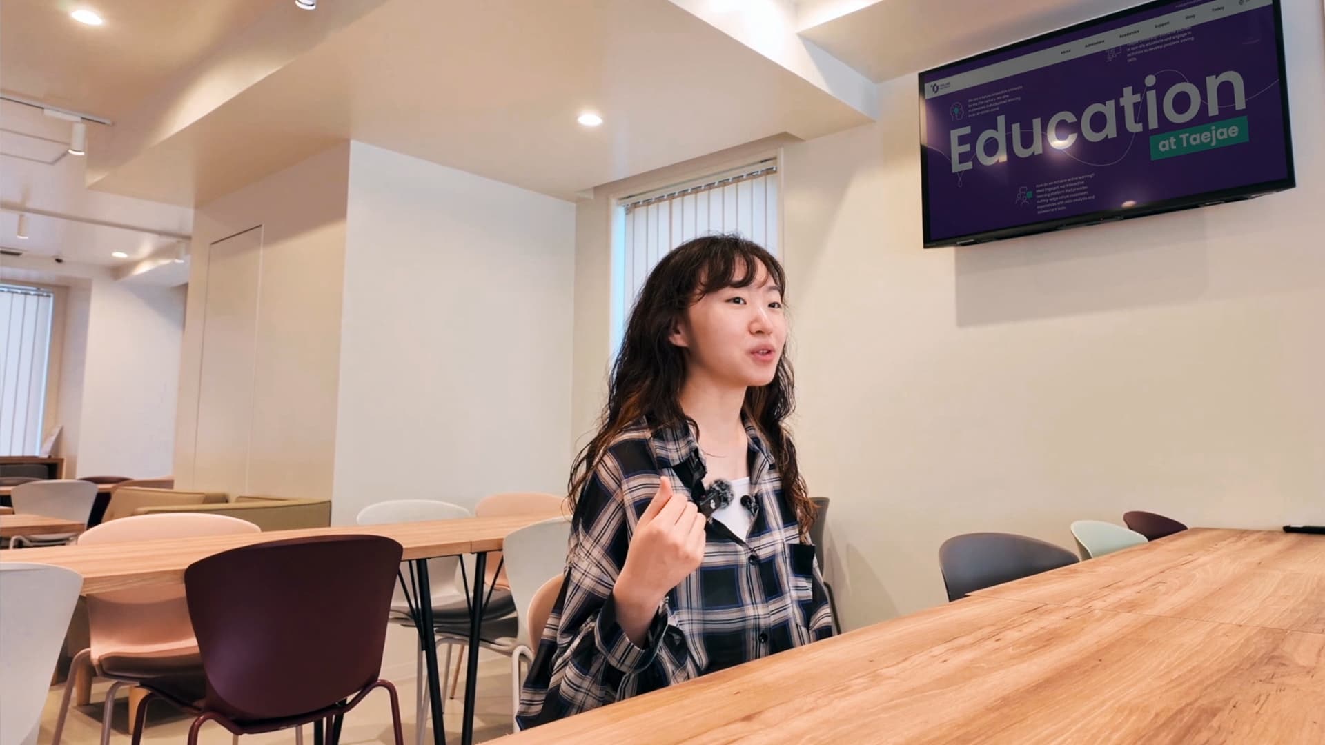 Photo of a man in a room using a tablet computer